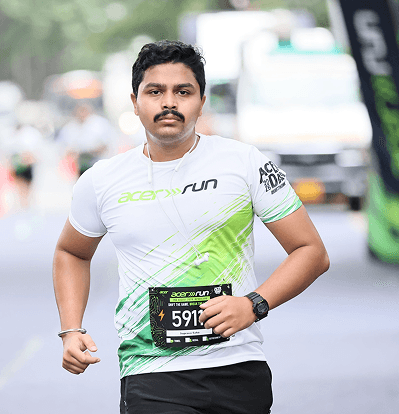 Running with a race bib on an empty morning road